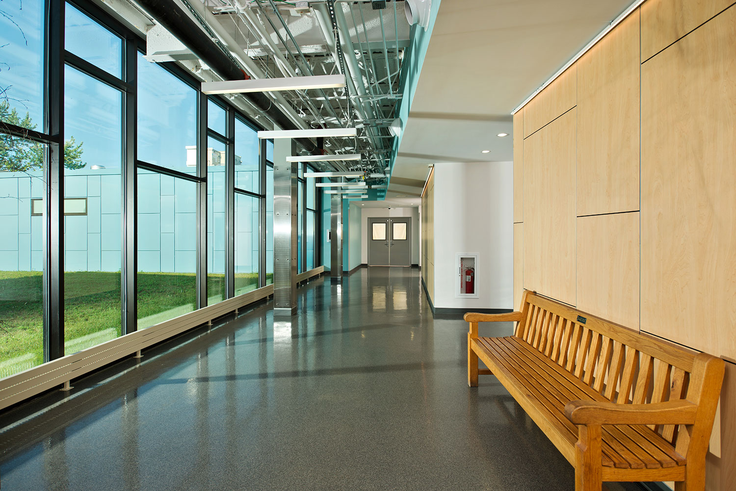 Naturally lit interior hallway. The 168,000-square-foot renovation includes new classrooms, technology labs, operational support spaces and administrative offices, as well as mechanical, electrical, plumbing and fire systems.